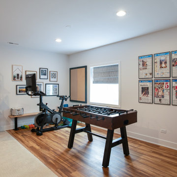 Finished Basement Game Room & Home Gym with Foosball Table & Exercise Bikes