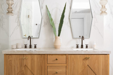 Inspiration for a mid-sized contemporary master stone slab and white tile double-sink, mosaic tile floor and multicolored floor bathroom remodel in Los Angeles with flat-panel cabinets, light wood cabinets, quartz countertops, beige countertops, a freestanding vanity, an undermount sink and white walls