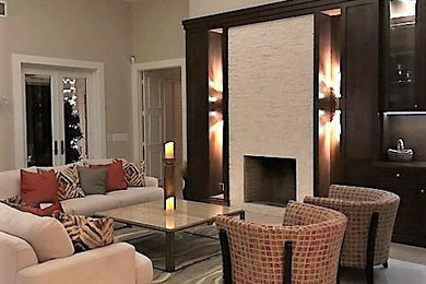 Example of a trendy formal and open concept linoleum floor and beige floor living room design in Miami with beige walls, a standard fireplace, a tile fireplace and no tv