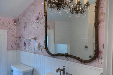 Small elegant master white tile and subway tile marble floor, white floor, single-sink and wallpaper alcove shower photo in Baltimore with a two-piece toilet, multicolored walls, a pedestal sink, a hinged shower door, a niche and a freestanding vanity