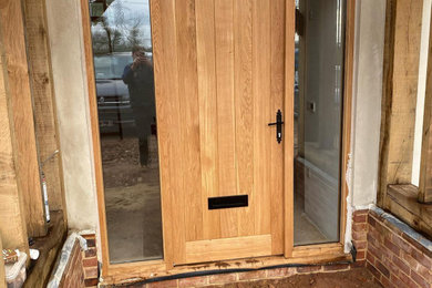 Photo of a large front door in Essex with a single front door.