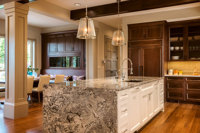Inspiration for a mid-sized timeless medium tone wood floor and exposed beam eat-in kitchen remodel in Orlando with medium tone wood cabinets, marble countertops, mosaic tile backsplash, stainless steel appliances, two islands, white countertops, an undermount sink and shaker cabinets