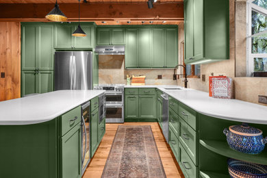 Eat-in kitchen - modern medium tone wood floor and wood ceiling eat-in kitchen idea in Other with an undermount sink, shaker cabinets, green cabinets, quartz countertops, brown backsplash, porcelain backsplash, stainless steel appliances and white countertops