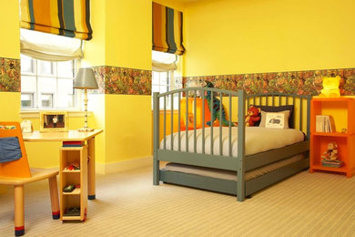Eclectic kids' bedroom in New York with yellow walls and carpet for boys and kids 4-10 years old.