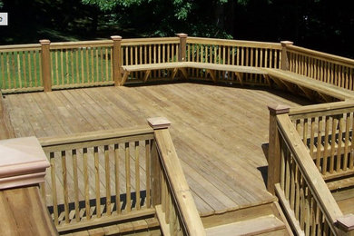 Example of a large arts and crafts backyard deck design in San Diego with no cover