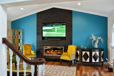 Large contemporary open concept living room in New York with blue walls, dark hardwood floors, a ribbon fireplace, a tile fireplace surround, a wall-mounted tv and brown floor.