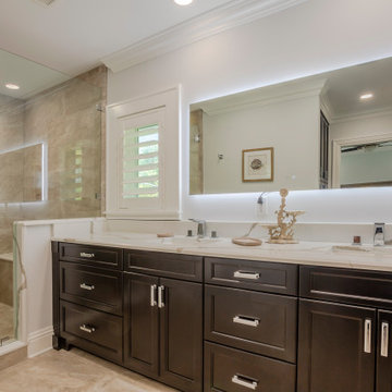 Sophisticated Modern Bathroom with Custom Double Vanity and Glass-Enclosed Walk-