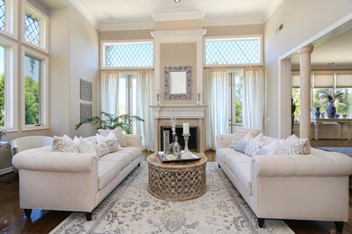Living room - traditional dark wood floor living room idea in Orange County with beige walls and no tv