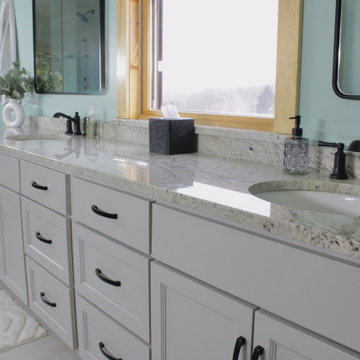 A double vanity with a separate makeup vanity