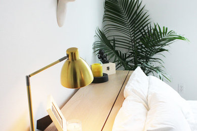 Small mid-century modern master bedroom photo in Seattle with white walls