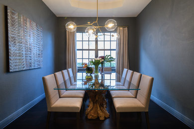 Photo of a large separate dining room in Miami with blue walls.