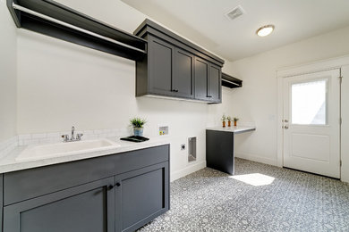 Example of a transitional laundry room design in Boise