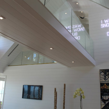 Glass Balustrade with Aluminum Base Rail Finished with Satin Brass Cladding