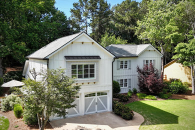 Huge traditional white two-story mixed siding and board and batten house exterior idea in Atlanta with a clipped gable roof, a shingle roof and a gray roof