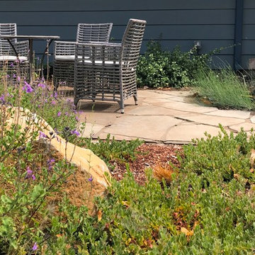 Intimate flagstone patio with basalt column fountain