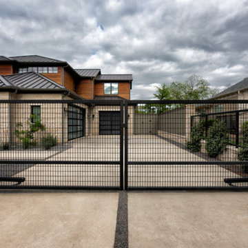 Custom Metal Fence & Electric Driveway Gate with Stone Accents