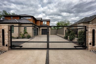 Large minimalist front yard stamped concrete patio photo in Dallas