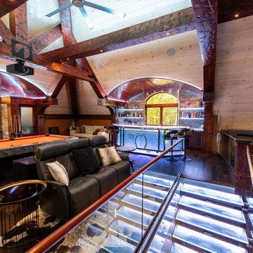 Glass private bar and glass stair treads inside a man cave in Michigan