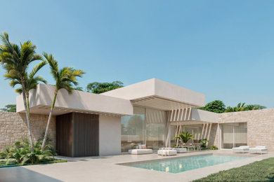 Diseño de fachada de casa mediterránea de tamaño medio con revestimiento de hormigón