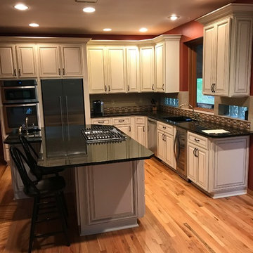 cabinet refacing---ant white raised panel cabinets