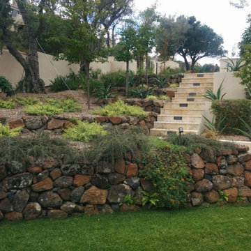 Front Slope with tiered Rock Walls