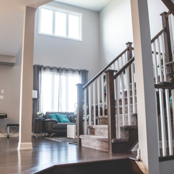 View of the great room and staircase from the foyer area