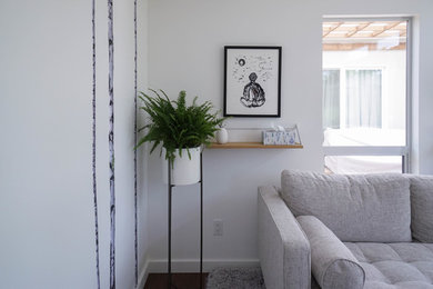 Mid-sized trendy freestanding desk dark wood floor and brown floor study room photo in San Francisco with white walls