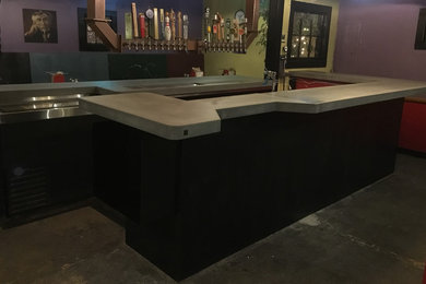 Inspiration for a large eclectic u-shaped seated home bar remodel in Seattle with concrete countertops and gray countertops