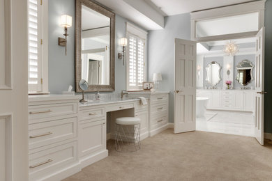 Large elegant carpeted and beige floor dressing room photo in Minneapolis with recessed-panel cabinets and white cabinets