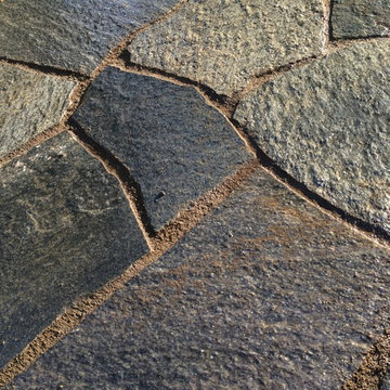 Chocolate Charcoal Quartzite Flagstone Patio with Basalt Column Fountain