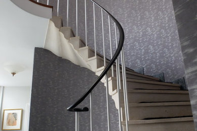 Design ideas for a large bohemian curved staircase in West Midlands with limestone treads and limestone risers.