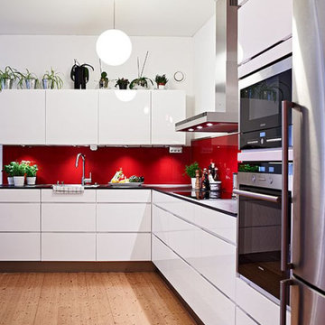 kitchen remodel modern with red backsplash
