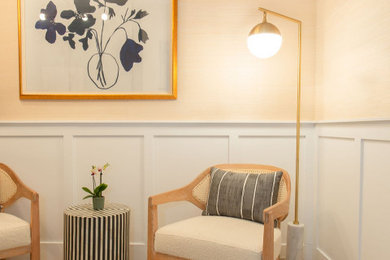 Small transitional freestanding desk light wood floor and wallpaper home office photo in Los Angeles with beige walls