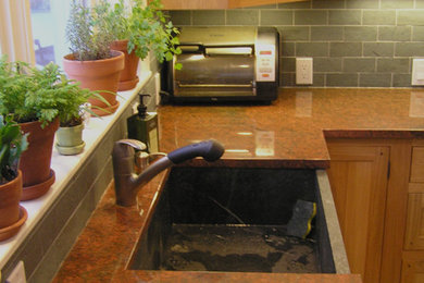 Example of a classic kitchen design in Other