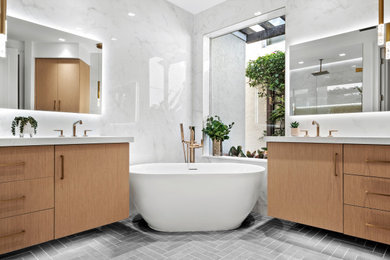 Small trendy master white tile and porcelain tile porcelain tile, gray floor and double-sink bathroom photo in Other with flat-panel cabinets, medium tone wood cabinets, a two-piece toilet, white walls, an undermount sink, quartz countertops, a hinged shower door, white countertops, a niche and a floating vanity