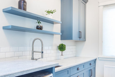 Laundry room - transitional laundry room idea in Other