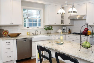 Eat-in kitchen - mid-sized transitional l-shaped dark wood floor eat-in kitchen idea in Cedar Rapids with a farmhouse sink, shaker cabinets, white cabinets, granite countertops, white backsplash, subway tile backsplash, stainless steel appliances and an island