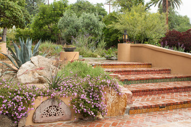 Photo of an expansive mediterranean front yard full sun xeriscape in Los Angeles with a garden path.