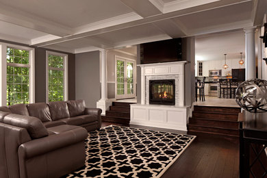 Large elegant formal and open concept dark wood floor living room photo in Baltimore with gray walls, a standard fireplace, a stone fireplace and a wall-mounted tv