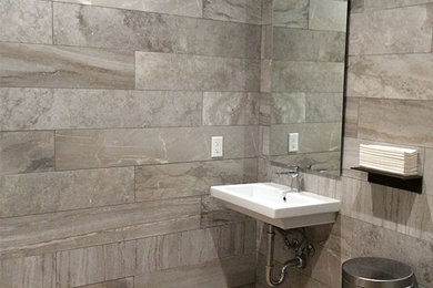 Trendy gray tile and porcelain tile bathroom photo in Houston