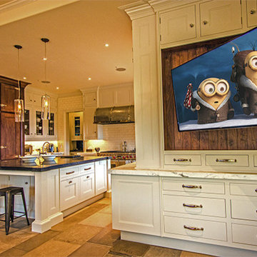 Kitchen with TV on motorized articulating arm