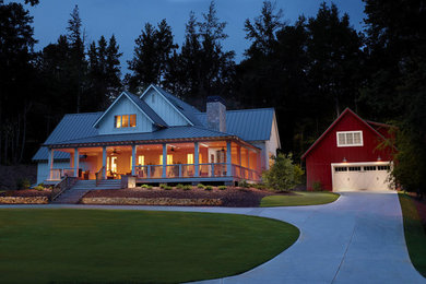 Example of a large country white two-story wood gable roof design in Atlanta