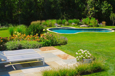 Design ideas for a mid-sized eclectic landscaping in New York.