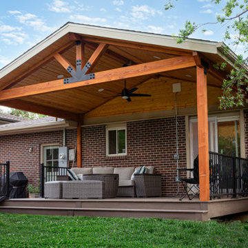 Boulder Patio Cover with Deckorators Decking and Railing and Stamped Concrete