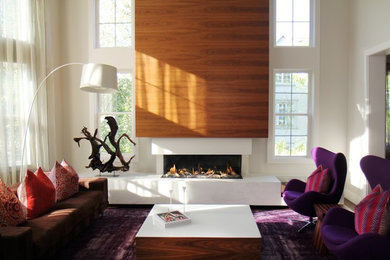Trendy dark wood floor living room photo in Toronto with gray walls, a two-sided fireplace, a wood fireplace surround and no tv