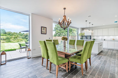 Contemporary dining room in Hampshire.