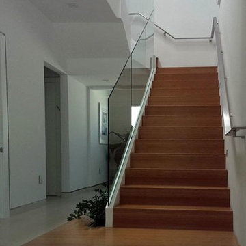 Glass railings + stainless steel flat-bar handrail