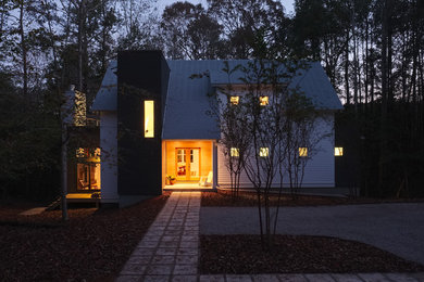 Inspiration for a mid-sized white two-story mixed siding gable roof remodel in Atlanta