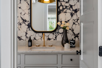 Transitional powder room photo in Other