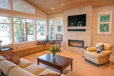 Traditional living room in Vancouver with a tile fireplace surround and a built-in media wall.